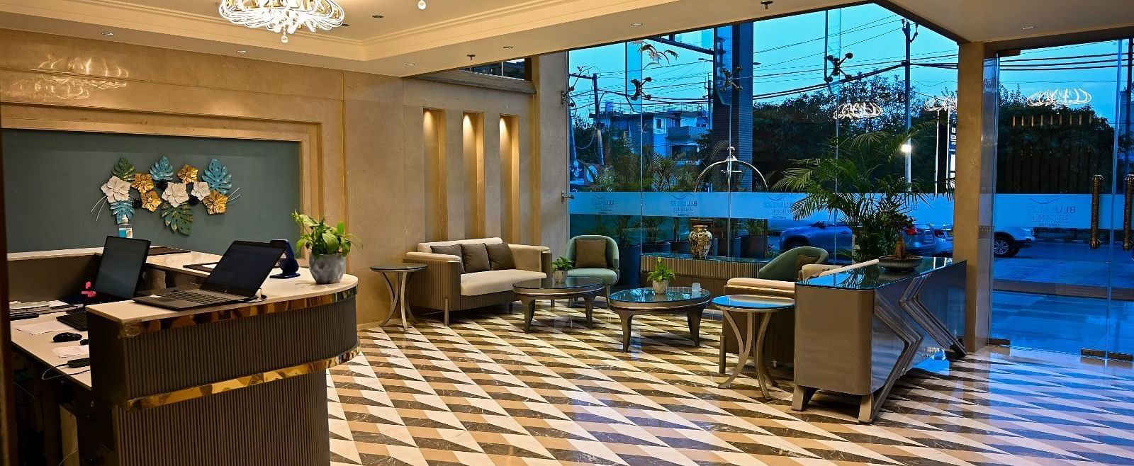 A spacious lobby featuring comfortable seating arrangements and a reception desk at 